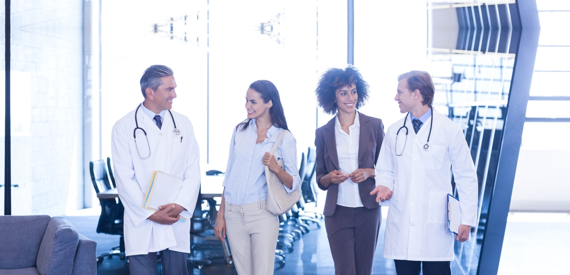 two doctors talking with adult women