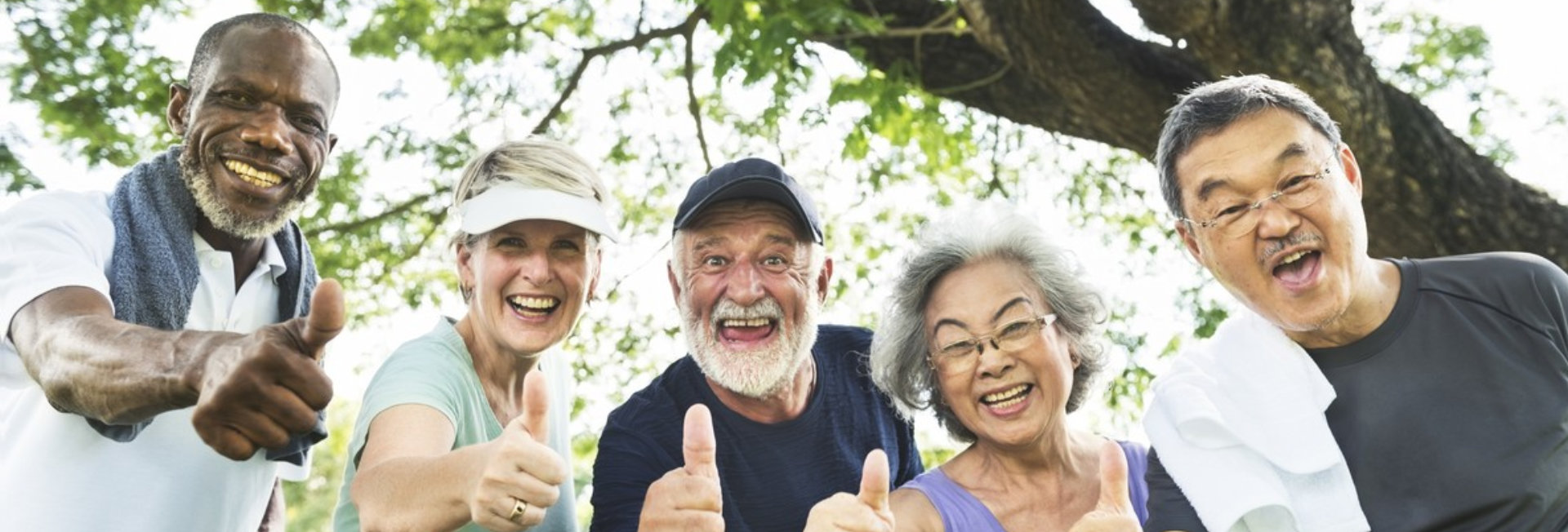 group of senior thumbs up and smiling