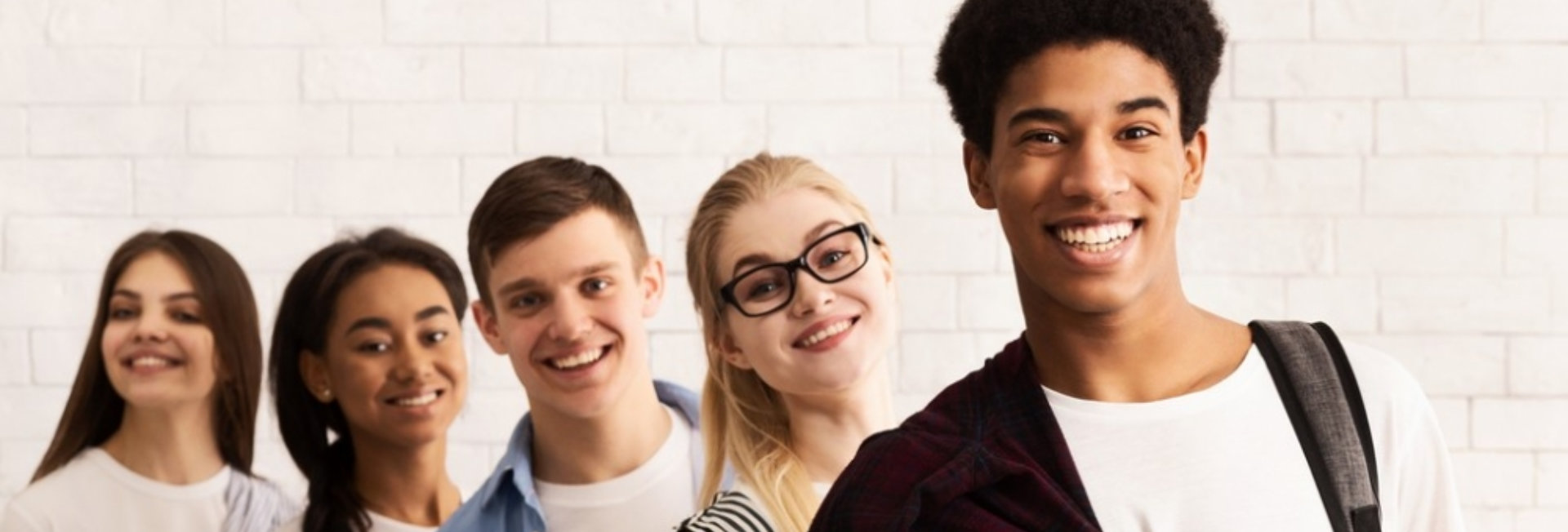 college student smiling with white background 