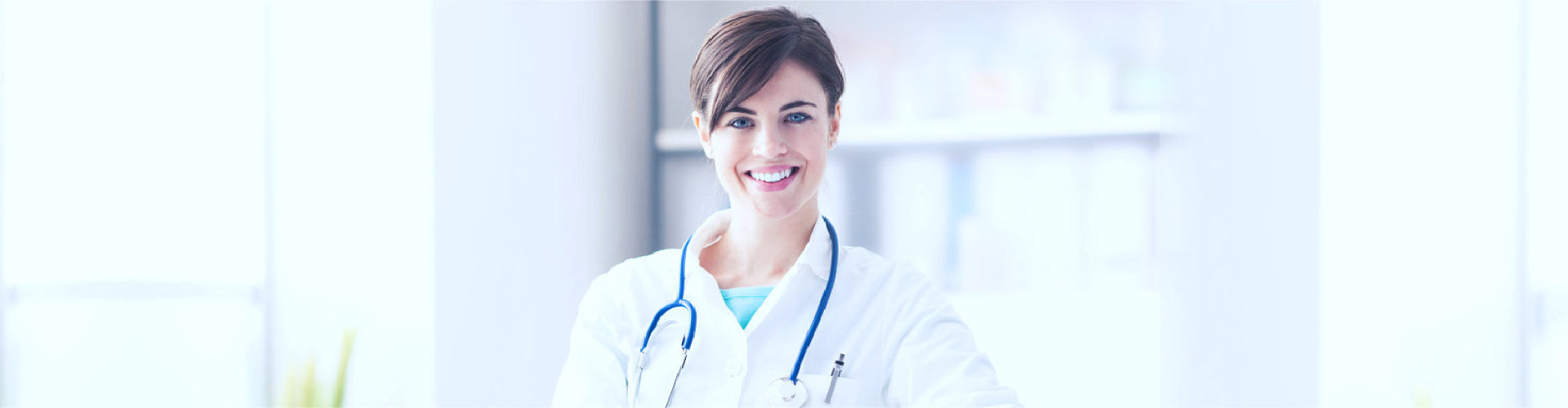female doctor wearing stethoscope smiling