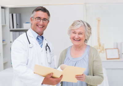 doctor along with his patient smiling