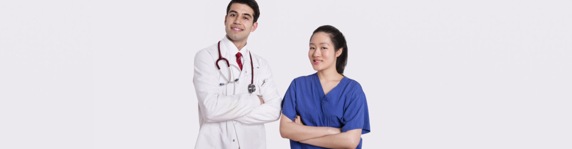 doctor wearing stethoscope and nurse smiling